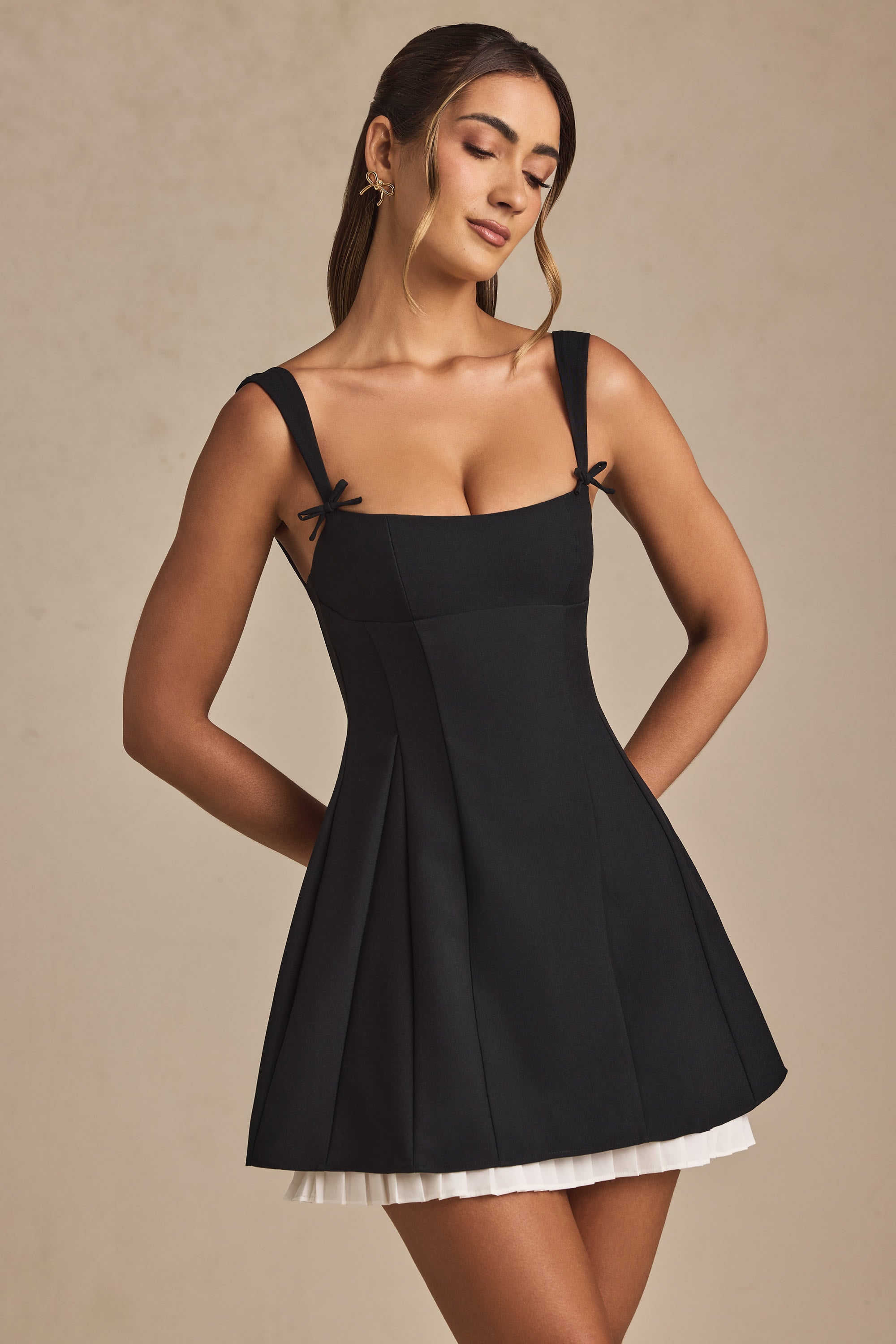 Cressida Bow-Detail Pleated A-Line Mini Dress in Black | Oh Polly