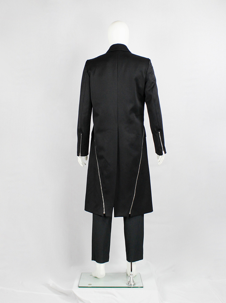 Xavier Delcour black long coat with two silver zippers going from