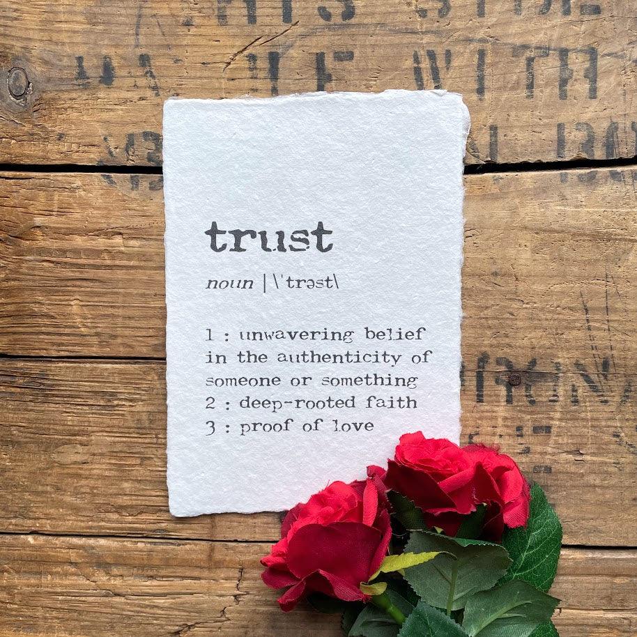 trust definition print in typewriter font on handmade cotton paper