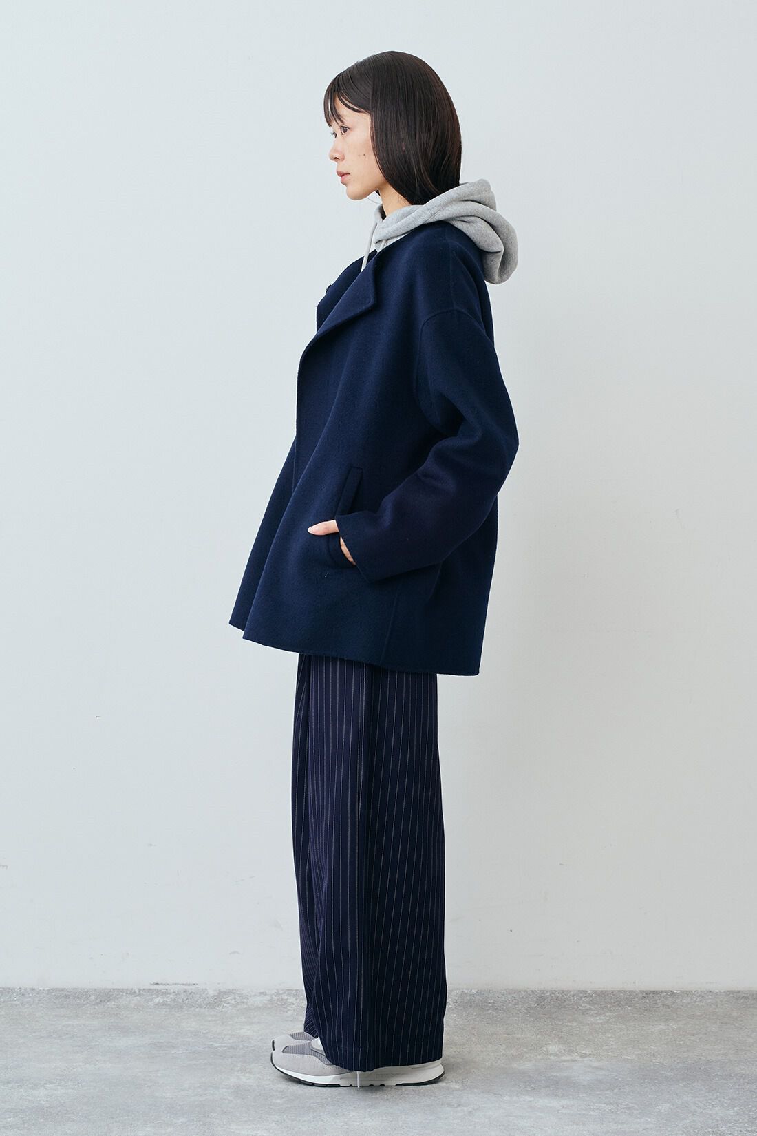 THREE FIFTY STANDARD リバー仕立てのウール混ノーカラーコート