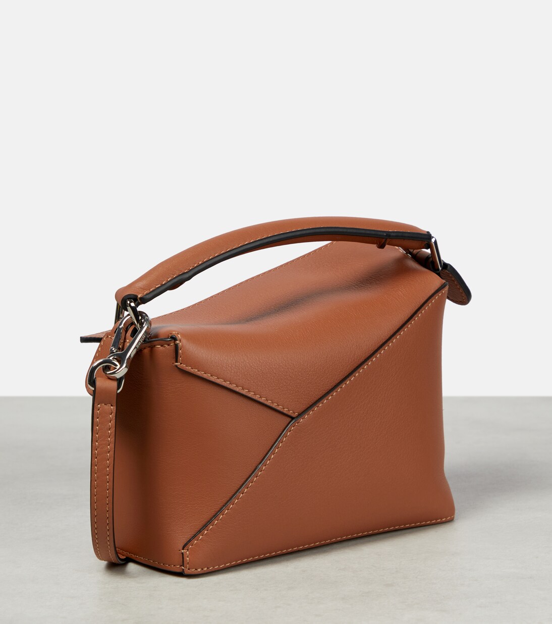 Puzzle Edge Mini leather tote bag in brown - Loewe | Mytheresa