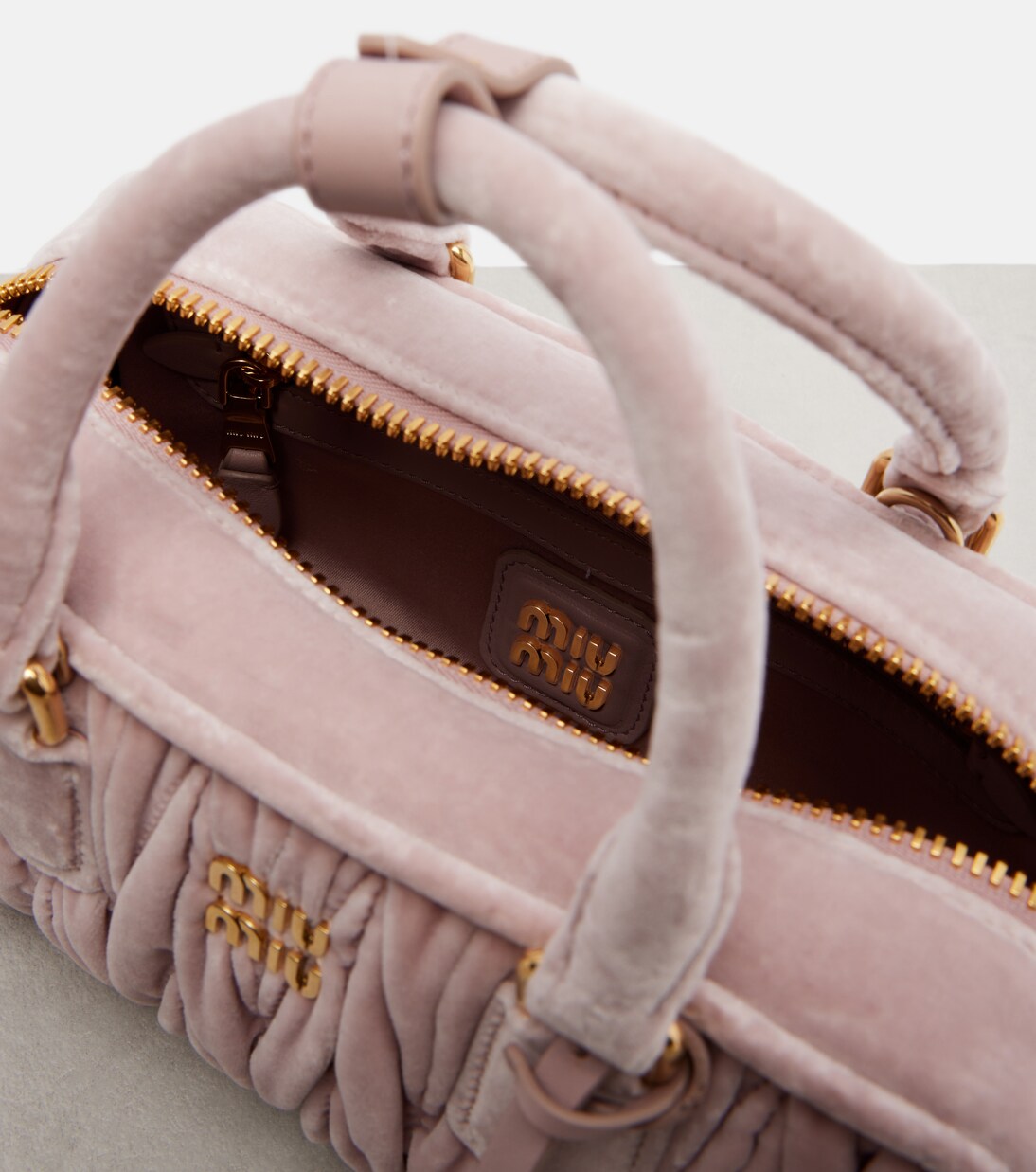 Arcadie Small suede top-handle bag in pink - Miu Miu | Mytheresa
