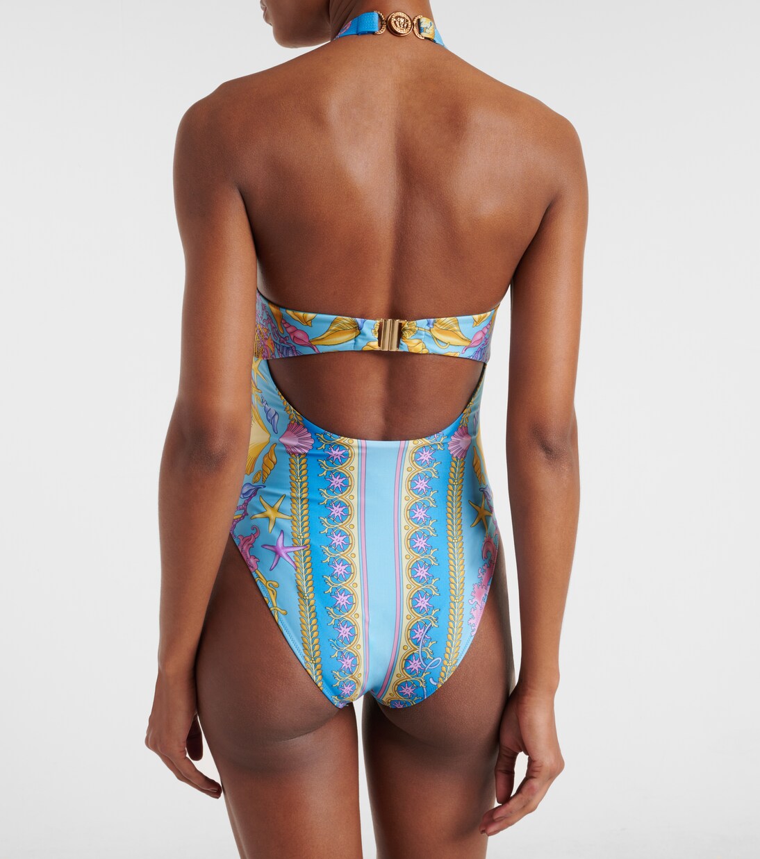 Printed halterneck swimsuit in turquoise - Versace | Mytheresa