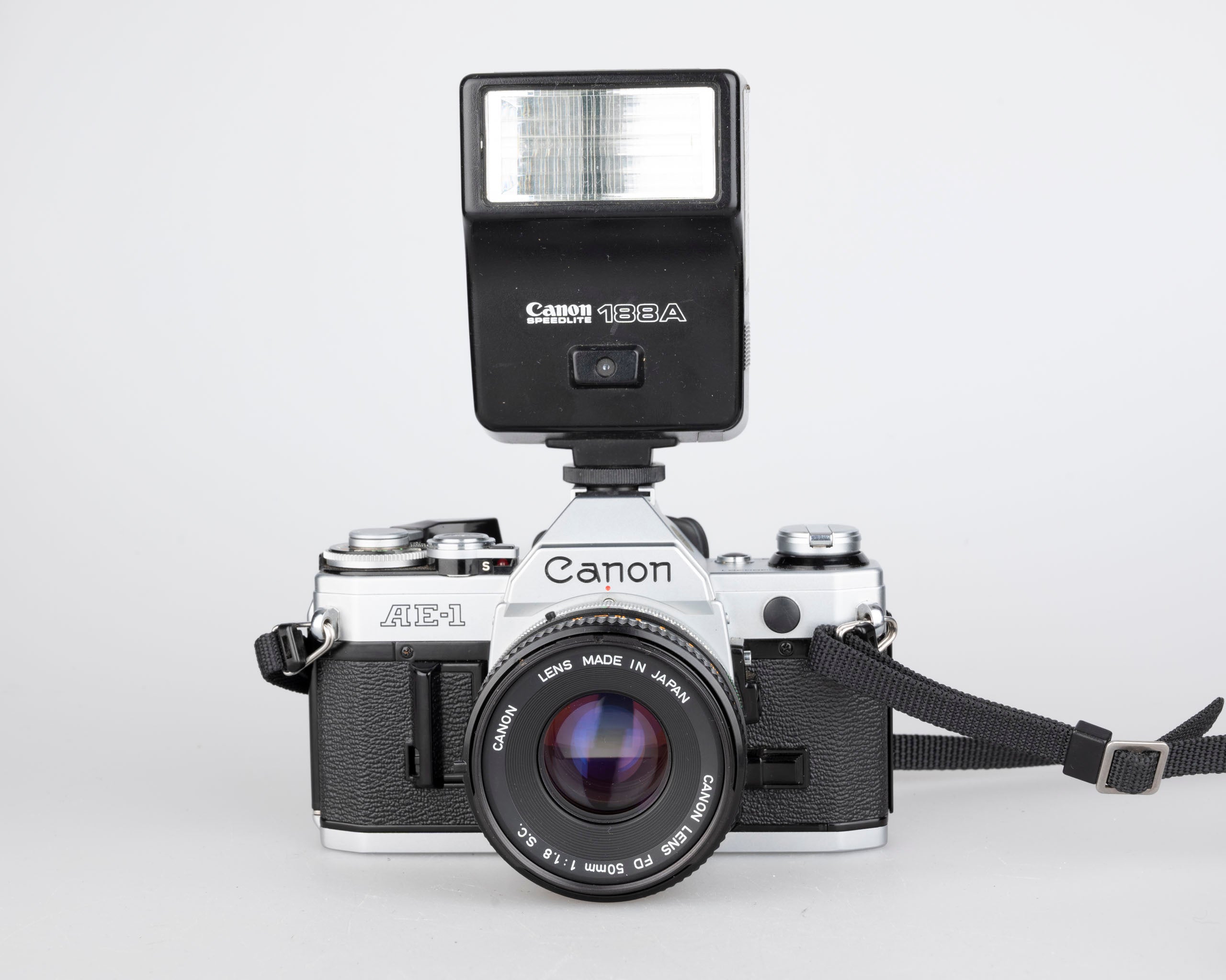 Canon AE-1 35mm SLR w/ Canon FD 50mm f1.8 lens + Speedlite 188A