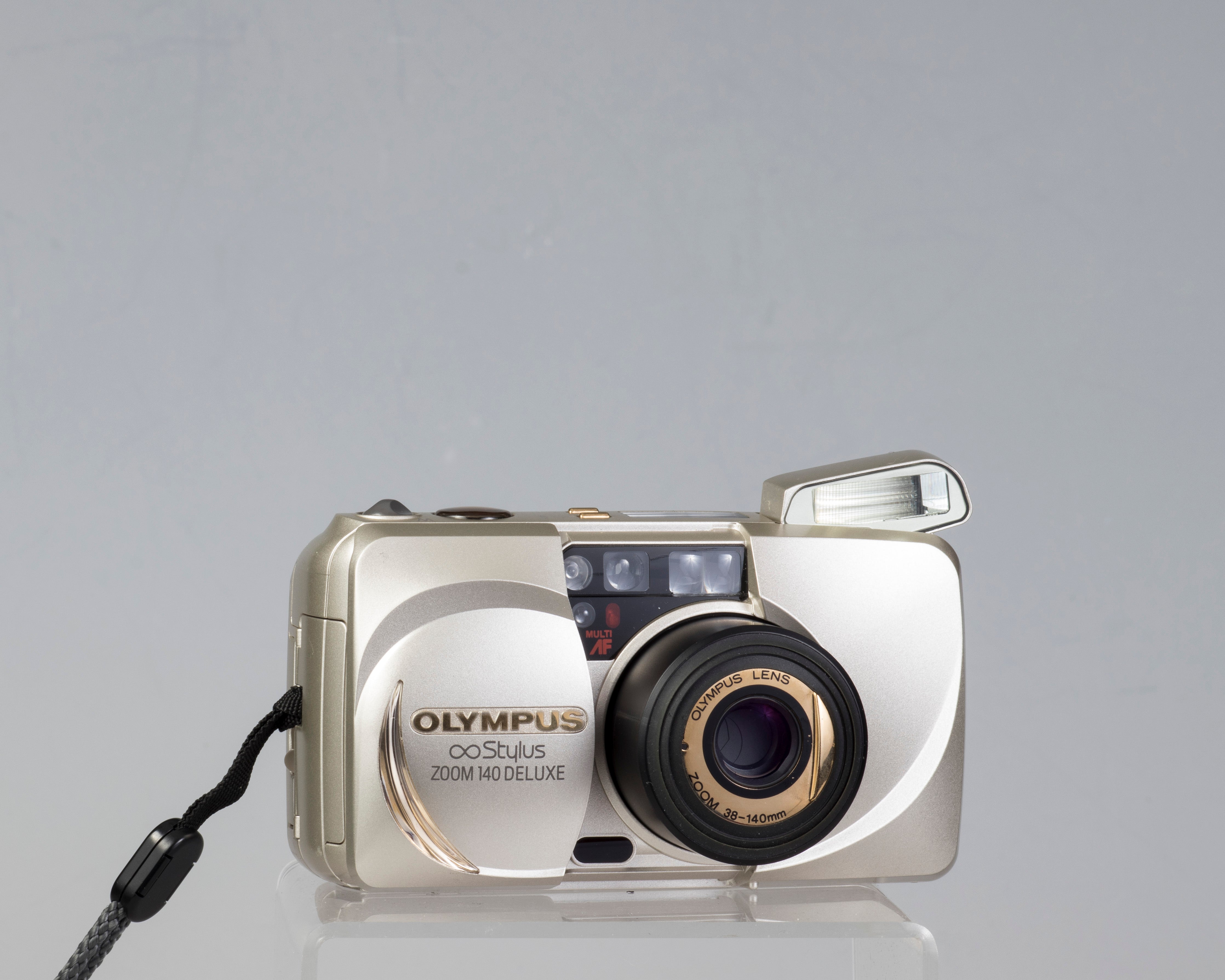 Olympus ∞ Stylus Zoom 140 Deluxe 35mm film camera (serial 4014772