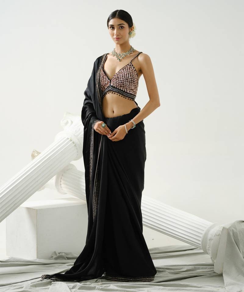Black geometric satin silk saree paired with a sequin embellished