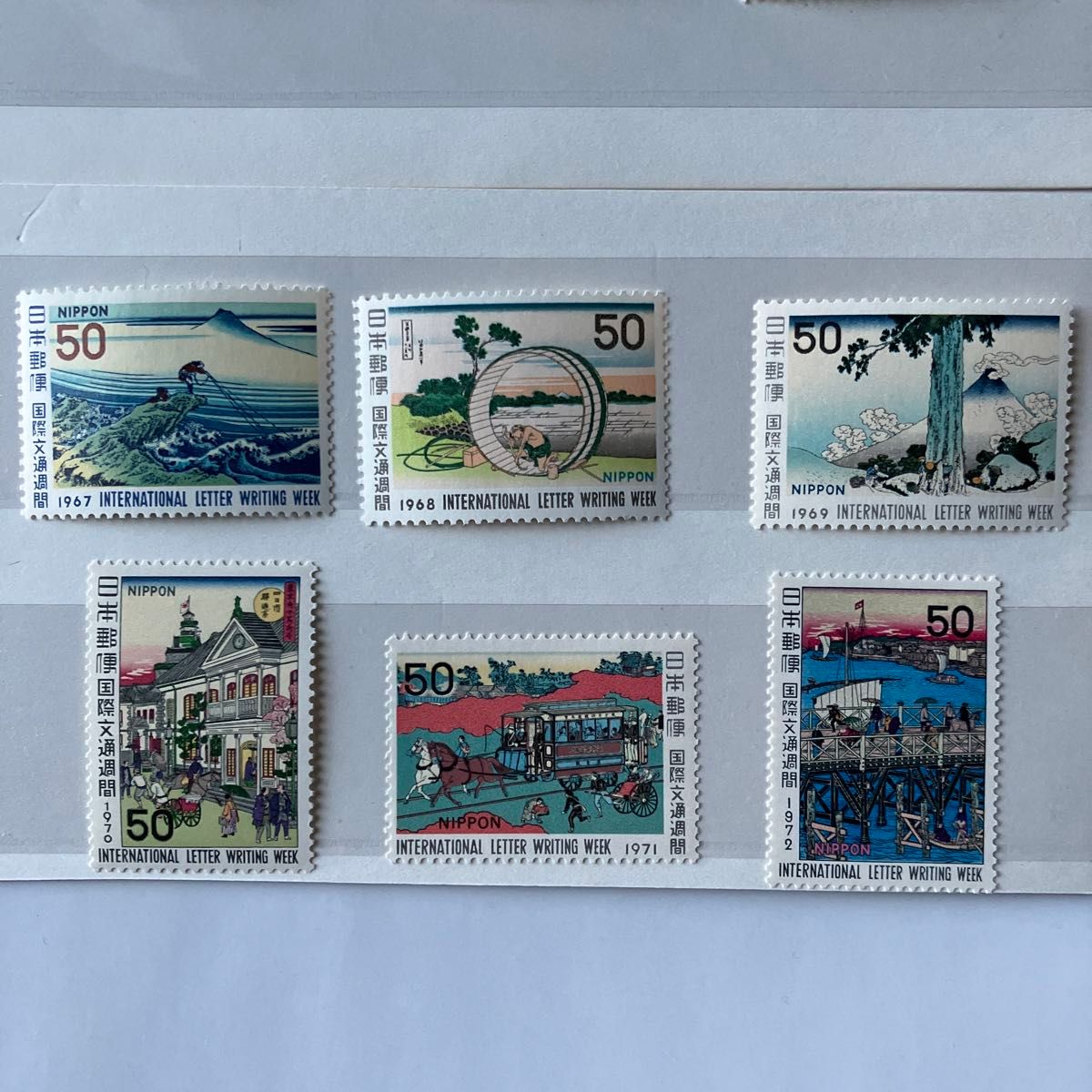 切手帖 国際文通週間 1980～2000 54枚収納 解説付 切手帖 国際文通週間