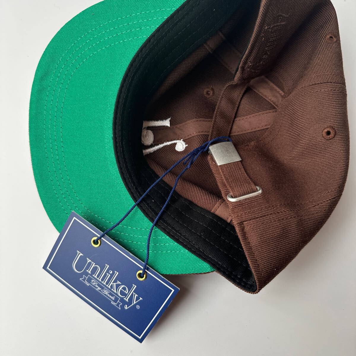 即完売 Unlikely×NEPENTHES NEW YORK CAP ブラウン アンライクリー
