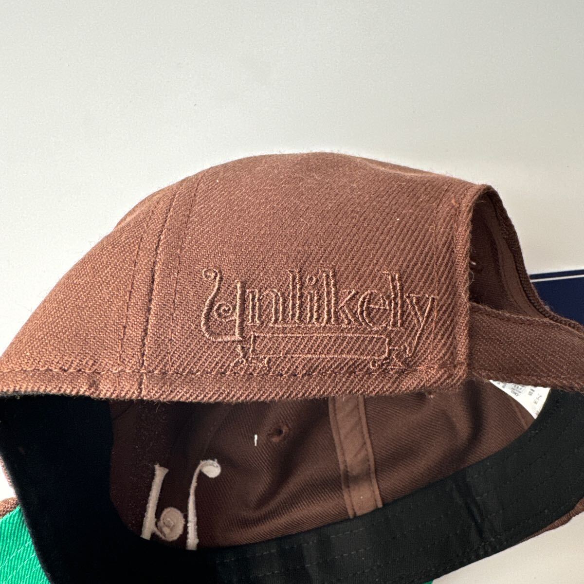 即完売 Unlikely×NEPENTHES NEW YORK CAP ブラウン アンライクリー