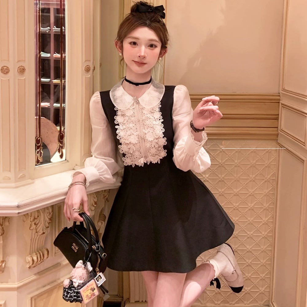 Olu. フリル付き黒長袖ミニワンピース Olu. フリル付き黒長袖ミニ