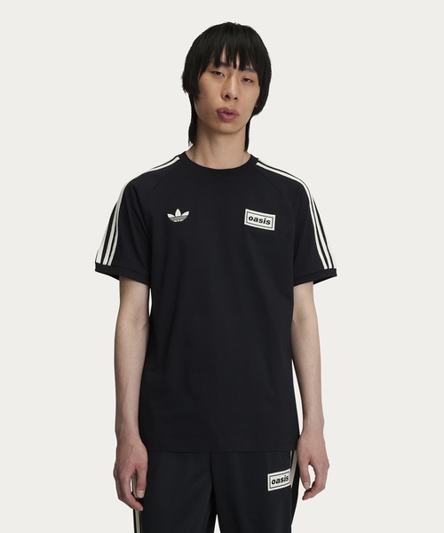 adidas Originals × Oasis ツアースリーストライプス Tシャツ