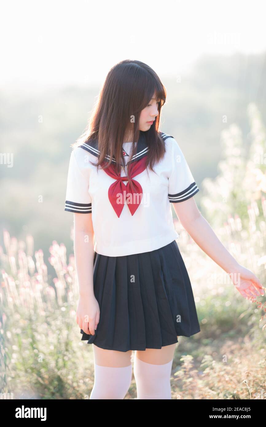 Portrait of asian japanese school girl costume looking at park
