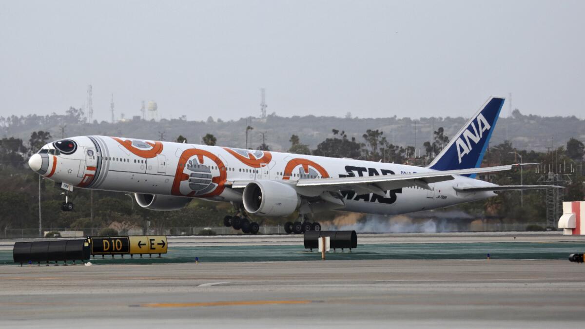 BB-8 and a jet decorated like the 'Star Wars' character land in