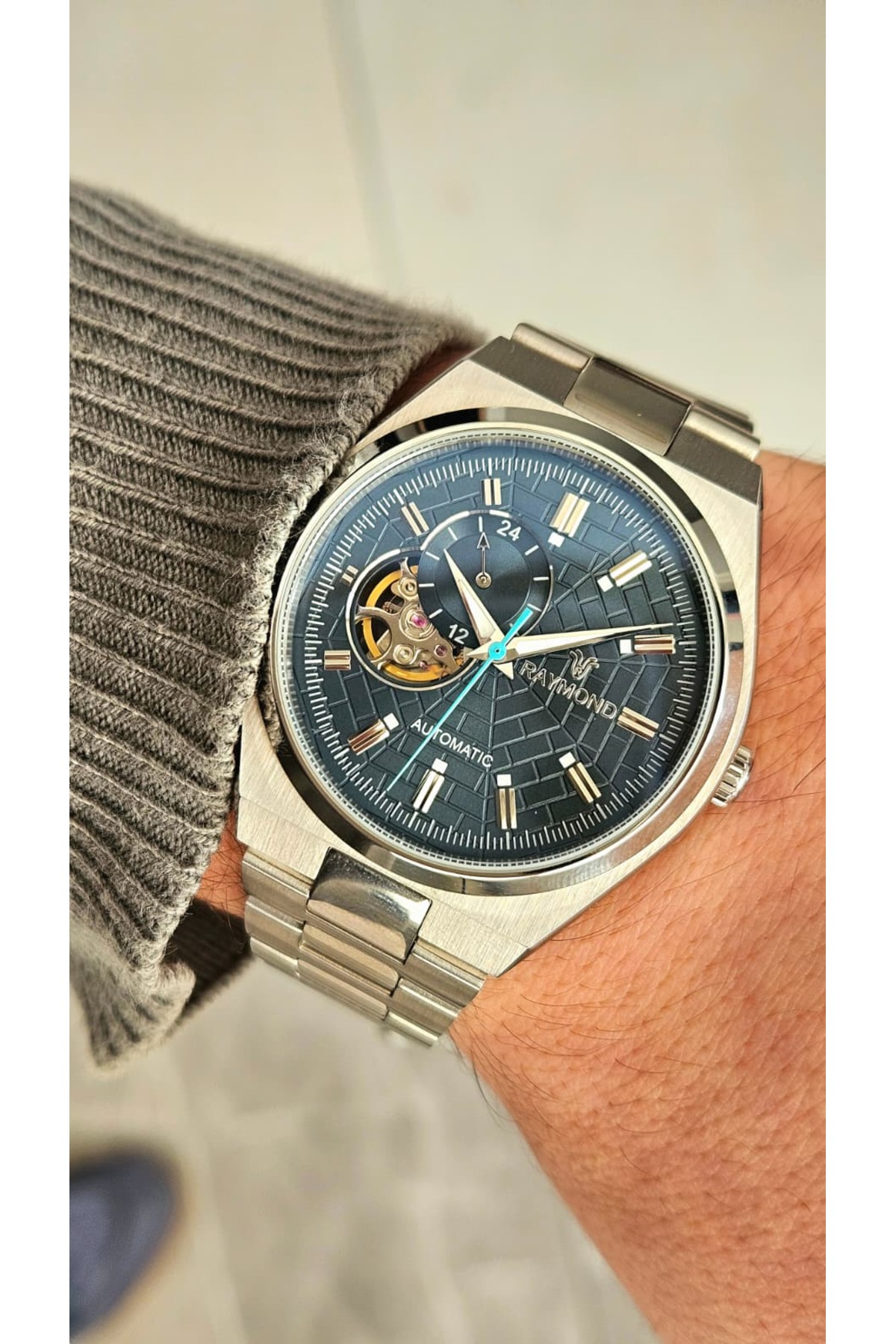 Raymond RYM-250424 ERKEK OTOMATİK SAAT - PASLANMAZ ÇELİK VE SAFİR
