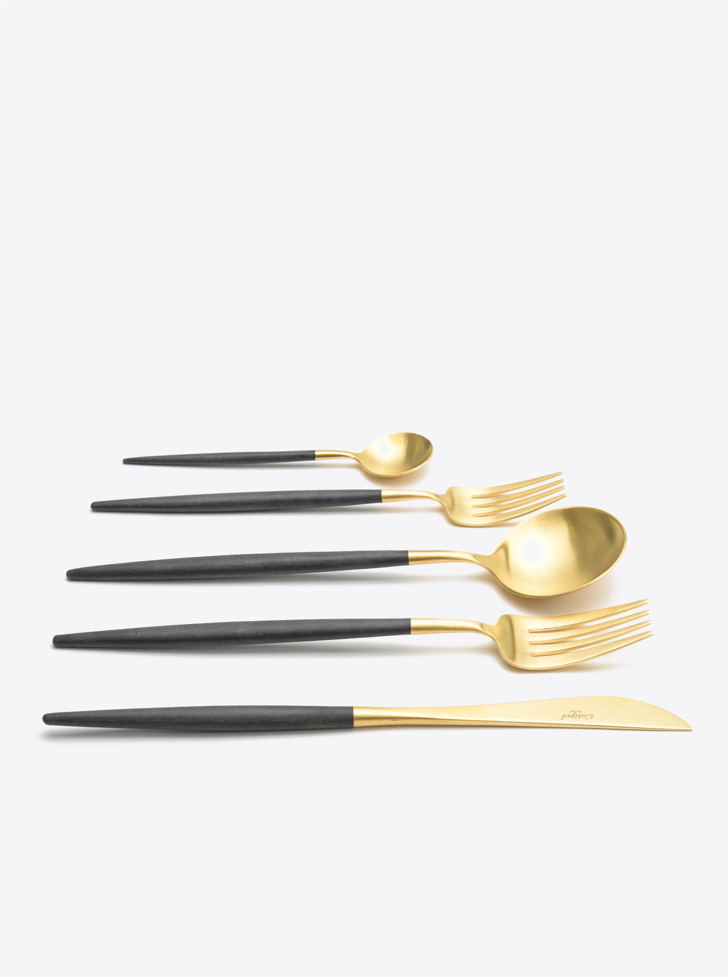 Cutlery Set Goa in gold matt with black resin handles. Made by