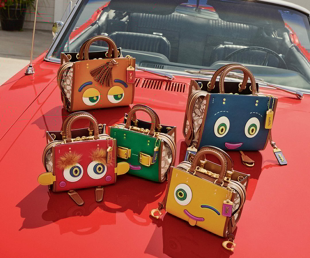 コーチが5種類のキャラクターをデザインしたバッグとカードケースを発売