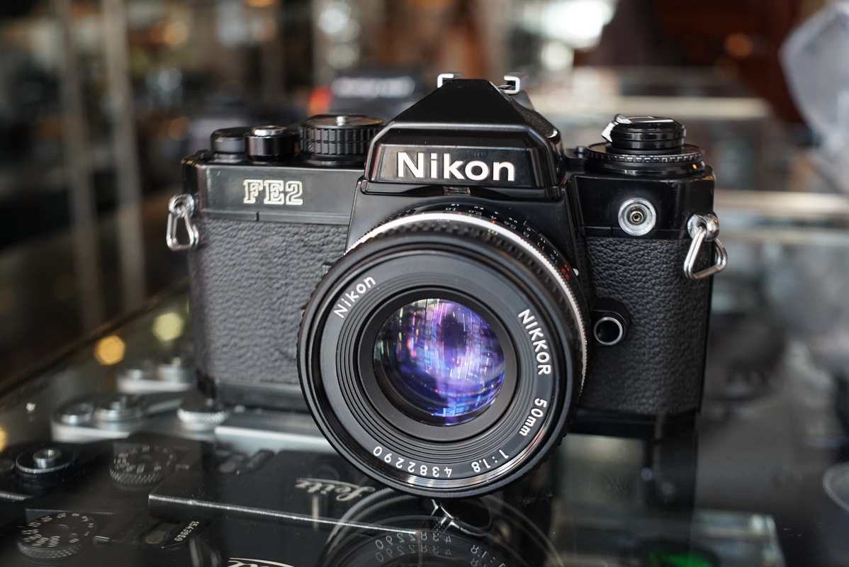 Nikon FE2 black + Nikkor 50mm F/1.8 AI-S - Fotohandel Delfshaven
