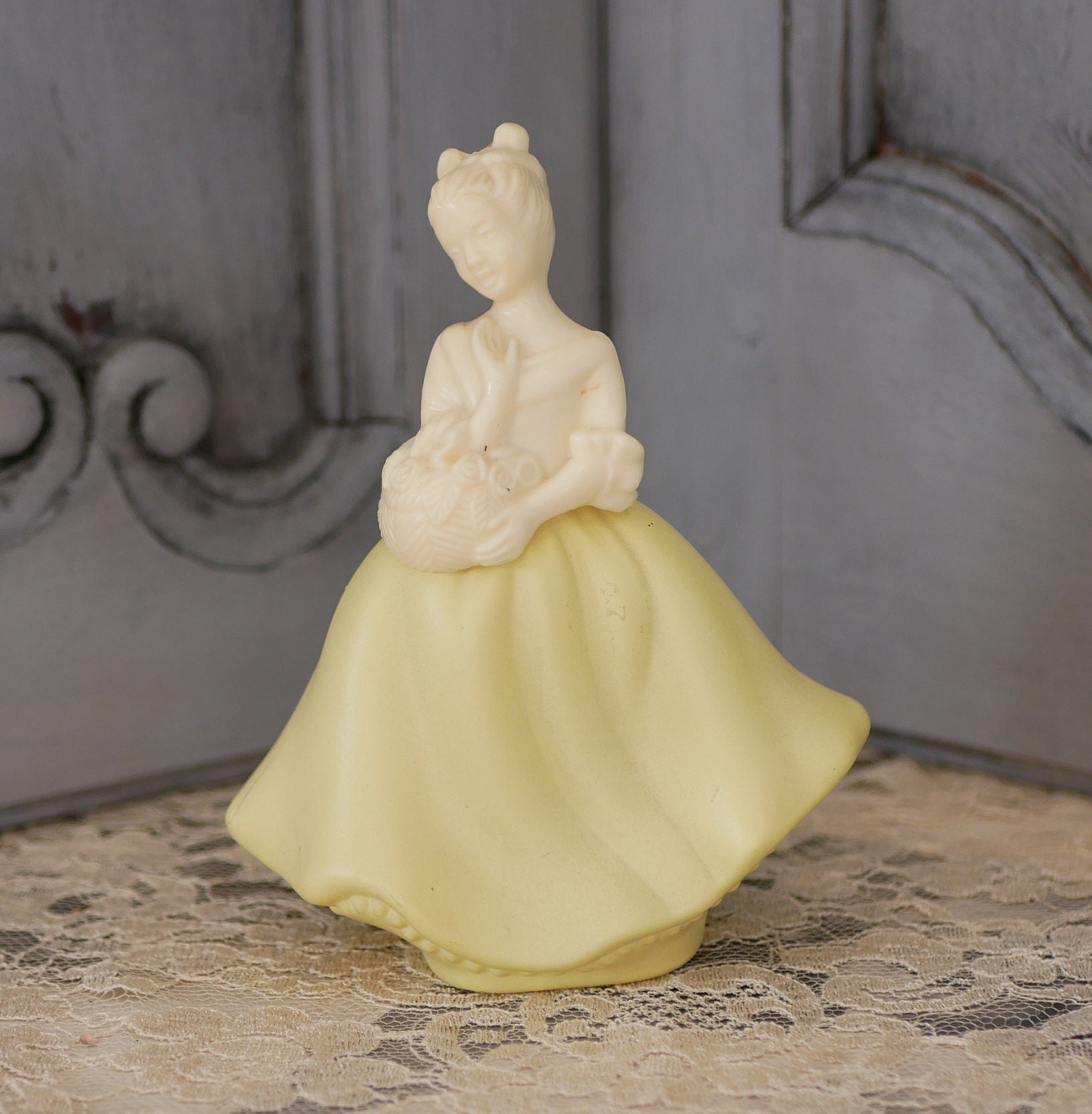 Vintage Avon Moonwind Perfume Bottle: Yellow Girl With Flower