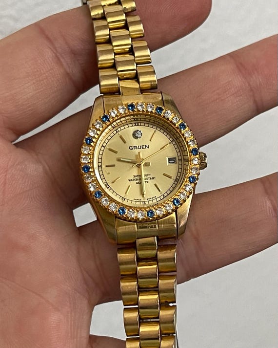 GRUEN Ladies Quartz Watch With Blue and Clear Crystals. Gold Tone