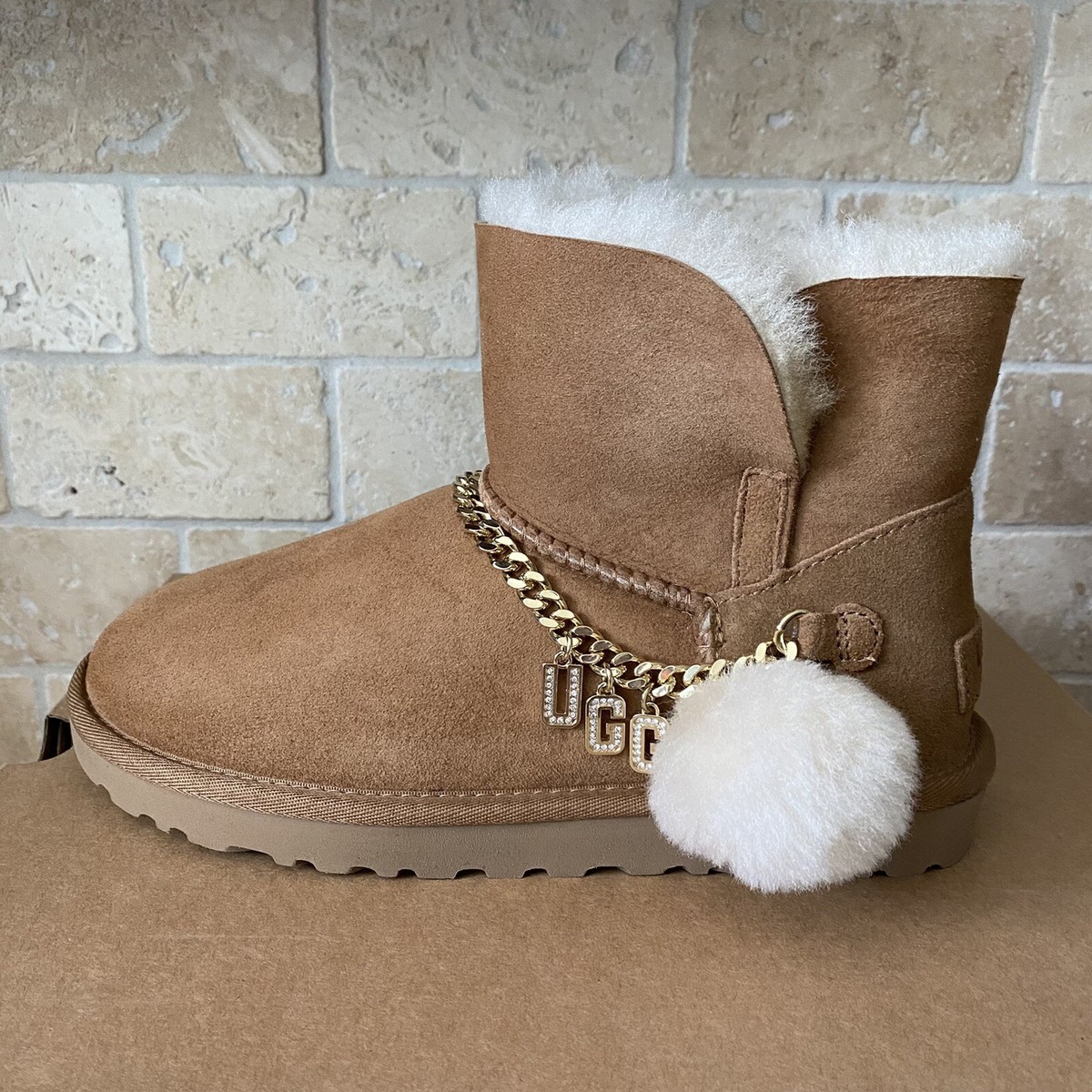 UGG CLASSIC UGG CHARM BLING LOGO POM CHESTNUT MINI BOOTS SIZE US