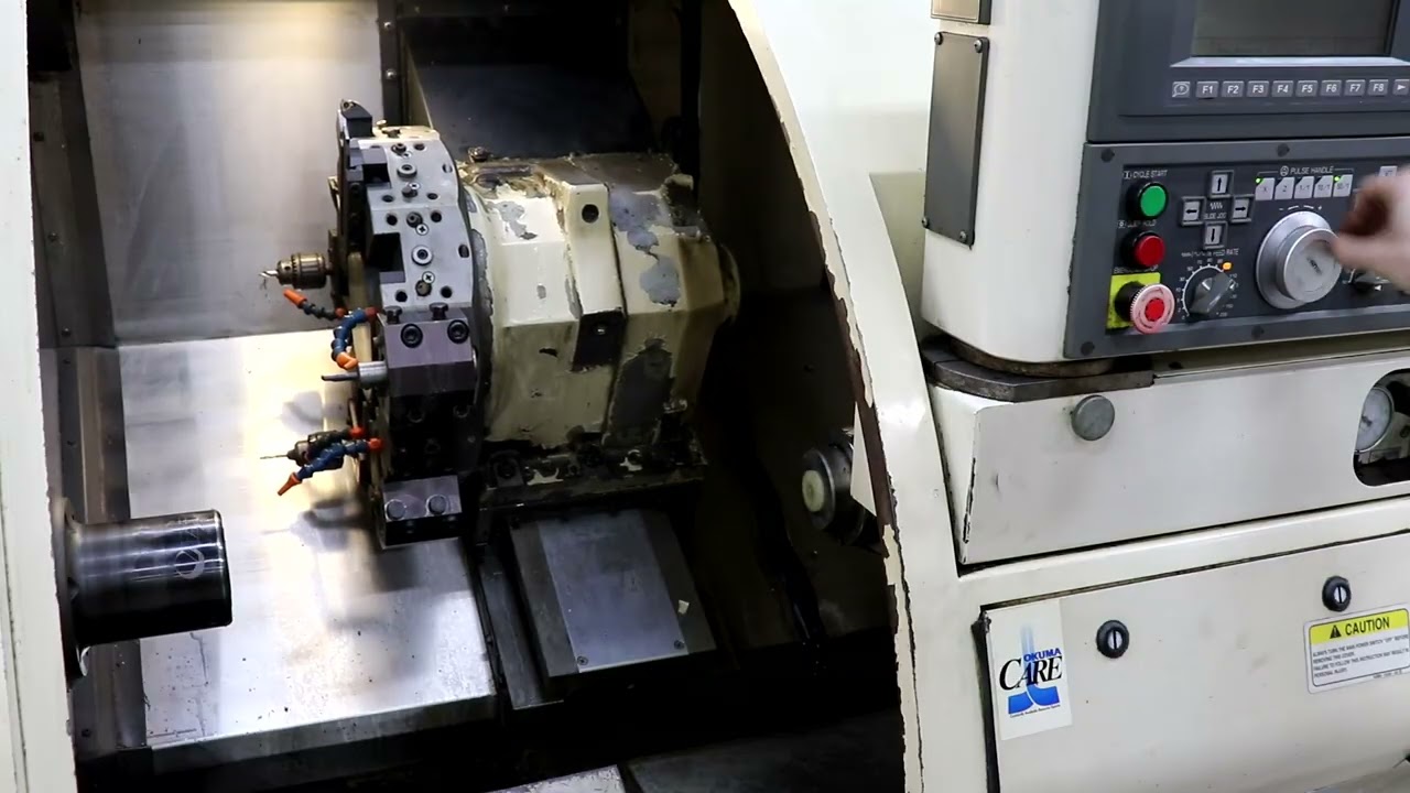 Okuma 762E 2-Axis CNC Lathe w/ Iemca VIP Bar Feeder - YouTube