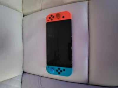 Nintendo OLED Model Switch with White Joy-Con, 7-inch OLED Screen