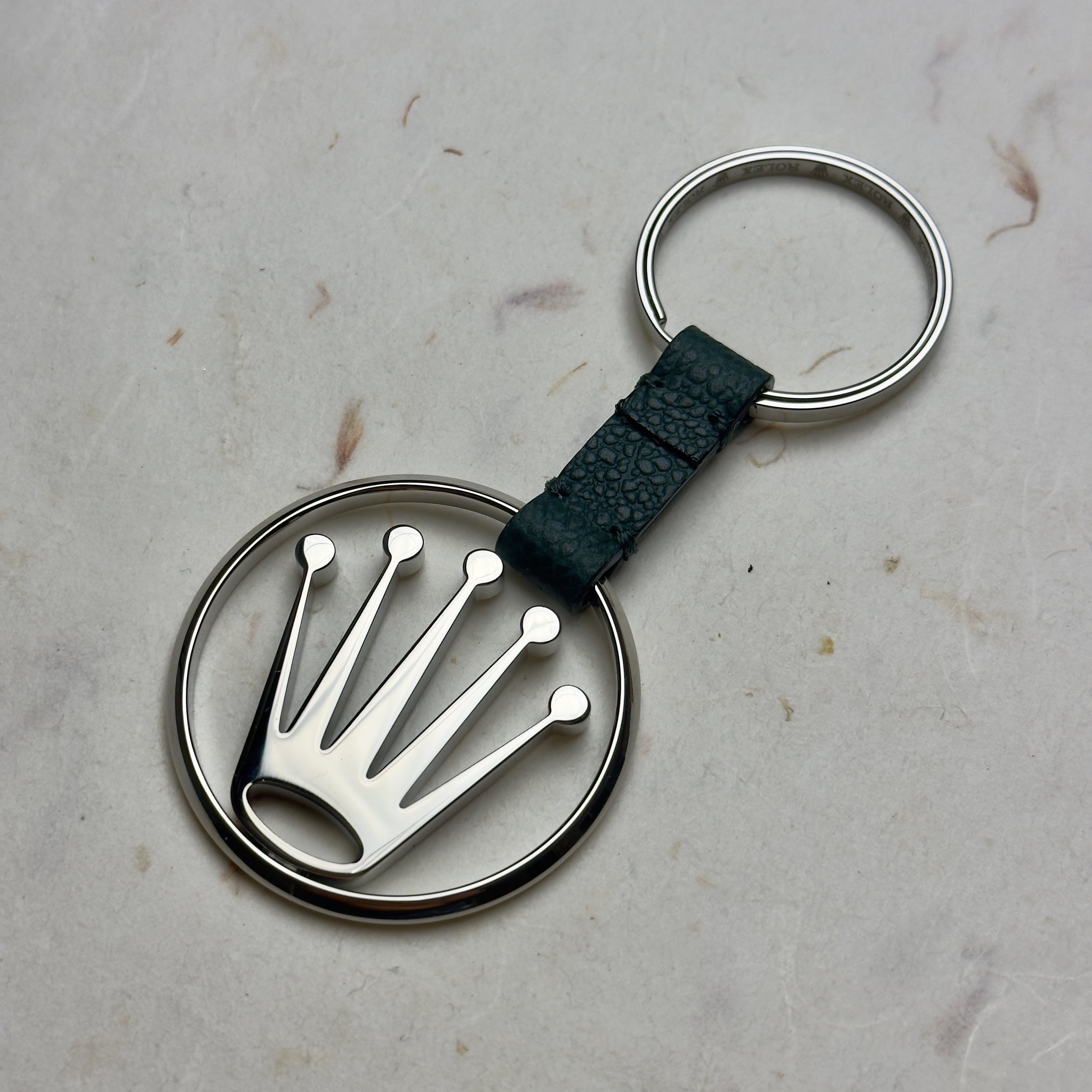 Elegant Rolex novelty keychain featuring a 3D silver crown logo