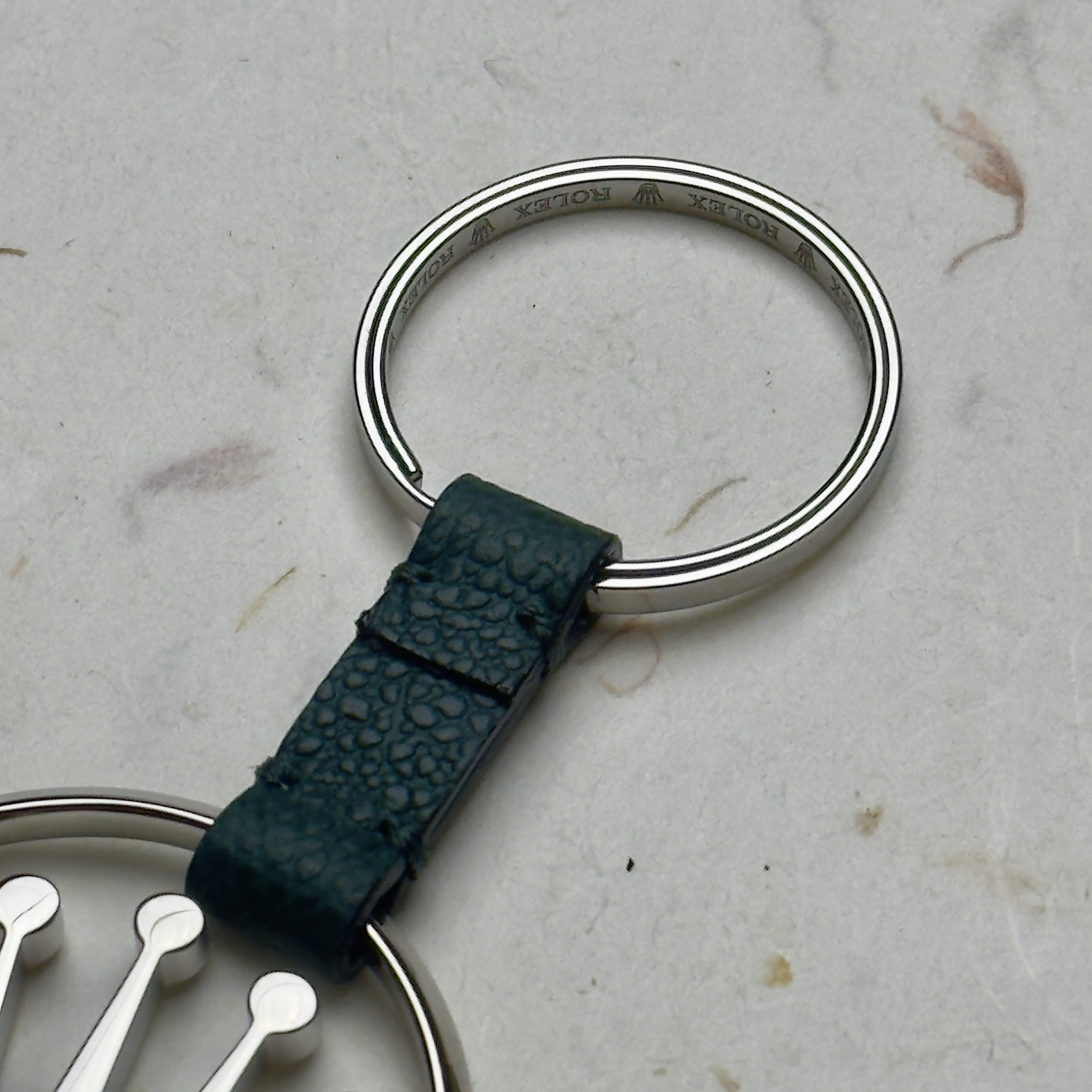 Elegant Rolex novelty keychain featuring a 3D silver crown logo