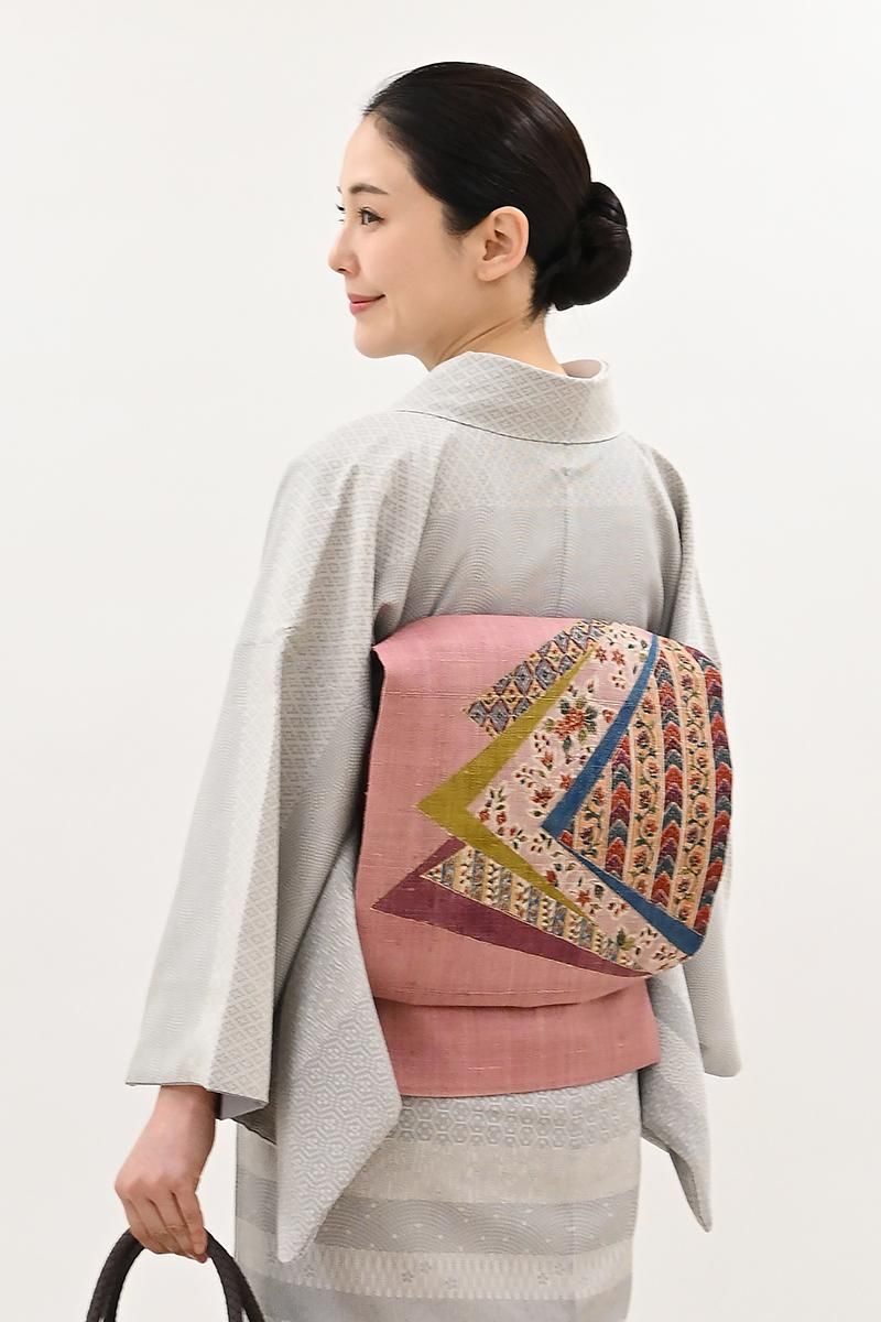 銀座【H-0993】大浦紫山作 紬地 金泥更紗 染名古屋帯 浅蘇芳色 裂取り