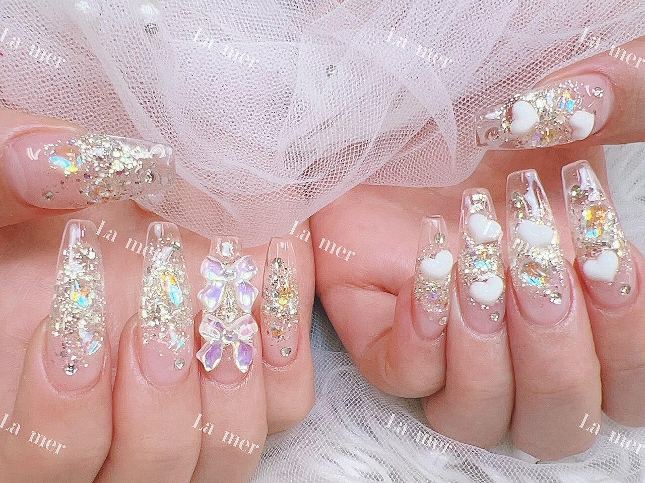 2026年冬トレンド】シルバー リボン ハンドのネイルデザイン集｜人気順