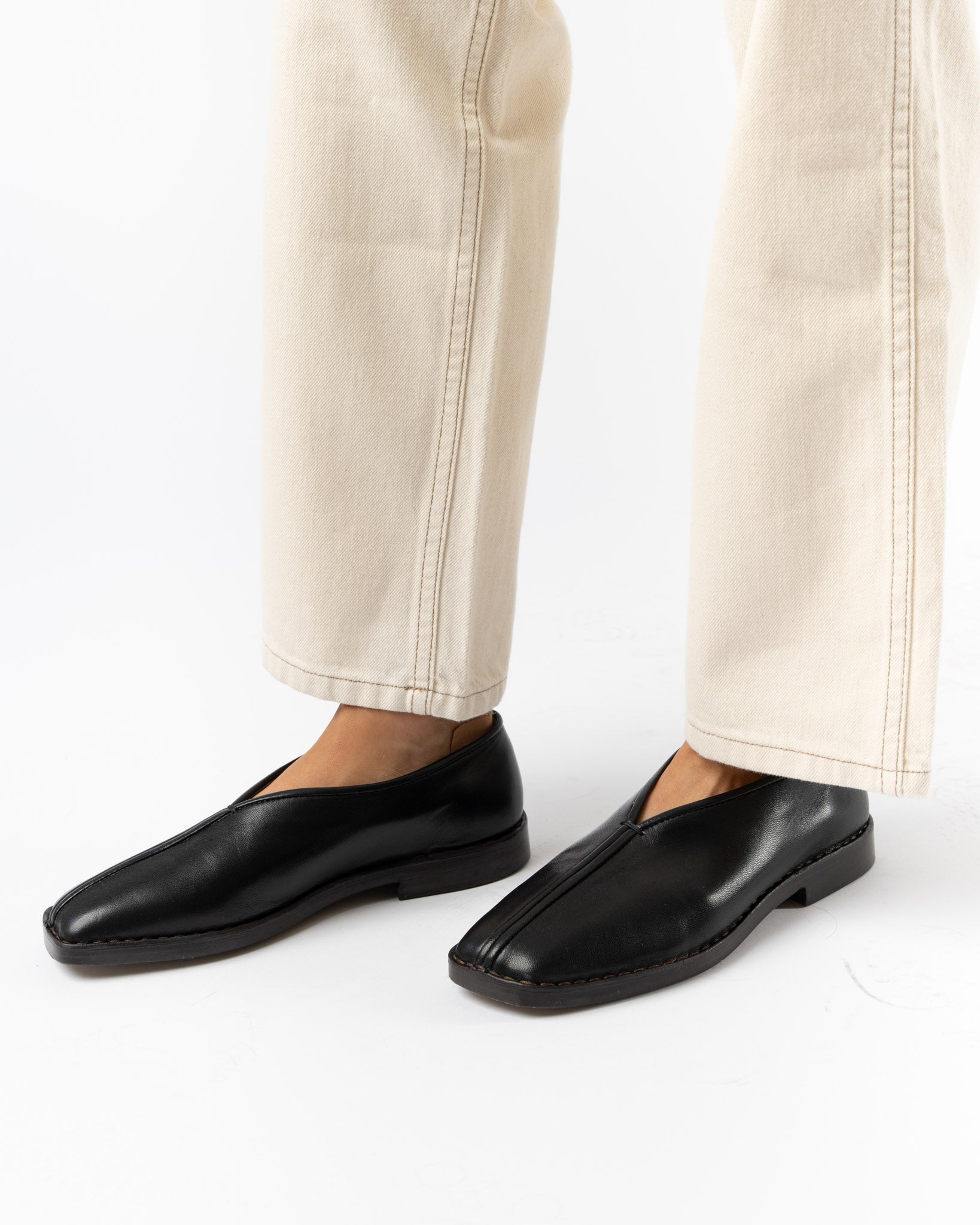 Lemaire Flat Piped Slippers in Black Curated at Jake and Jones