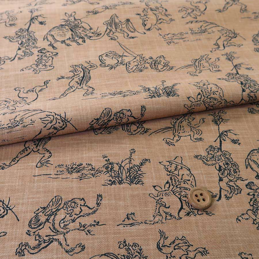 和柄コットン生地・鳥獣人物戯画(きゃら色) 10cm単位 切り売り |生地