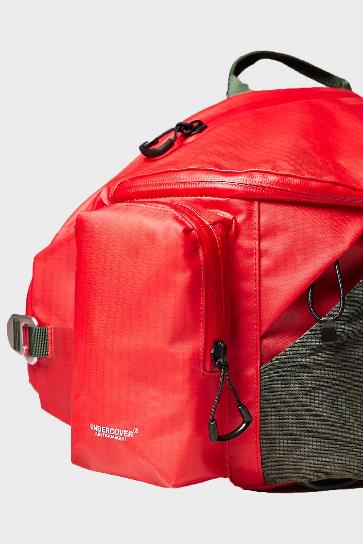 TNF x Undercover Soukuu Waistpack | Dark Cedar Green/High Risk Red