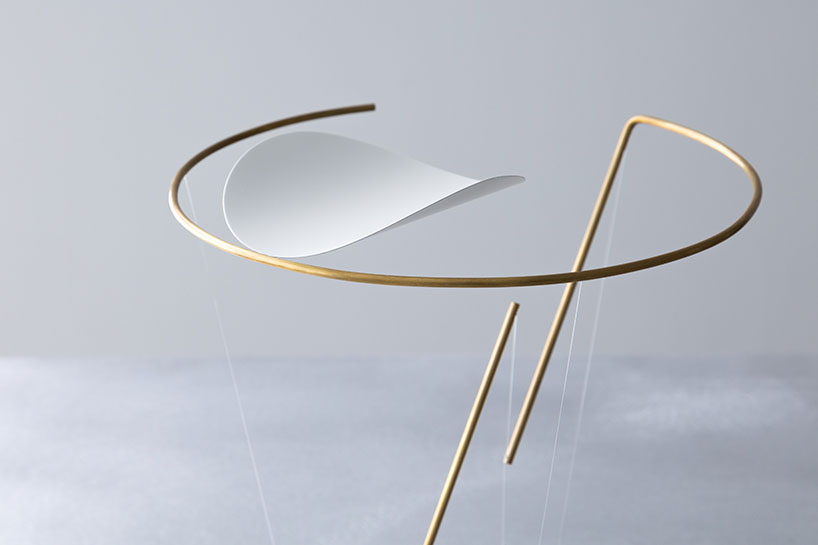 so koizumi's brass wind chime holds a delicate tensegrity structure