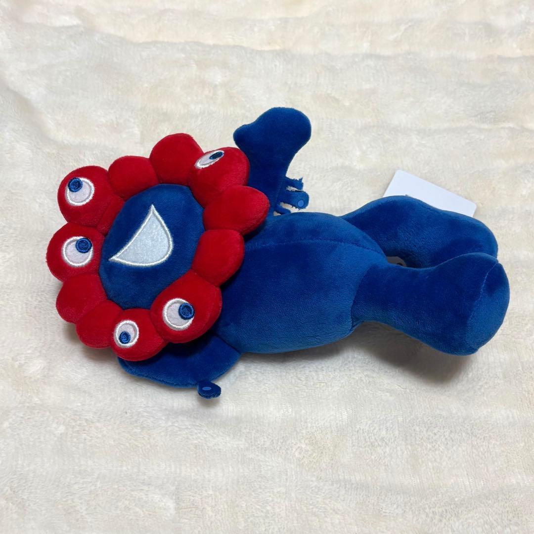 ミャクミャク 寝そべり ぬいぐるみ - メルカリ