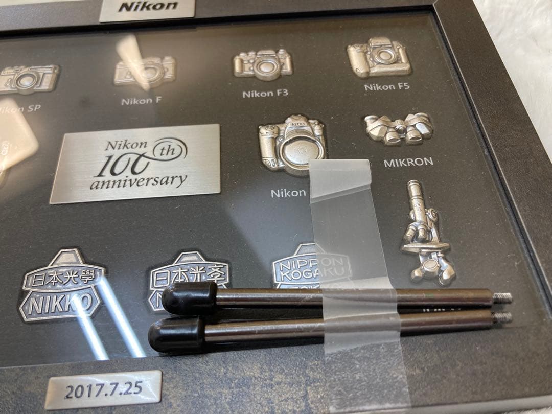 非売品】Nikon 100th anniversary 歴代カメラピンバッジ - メルカリ