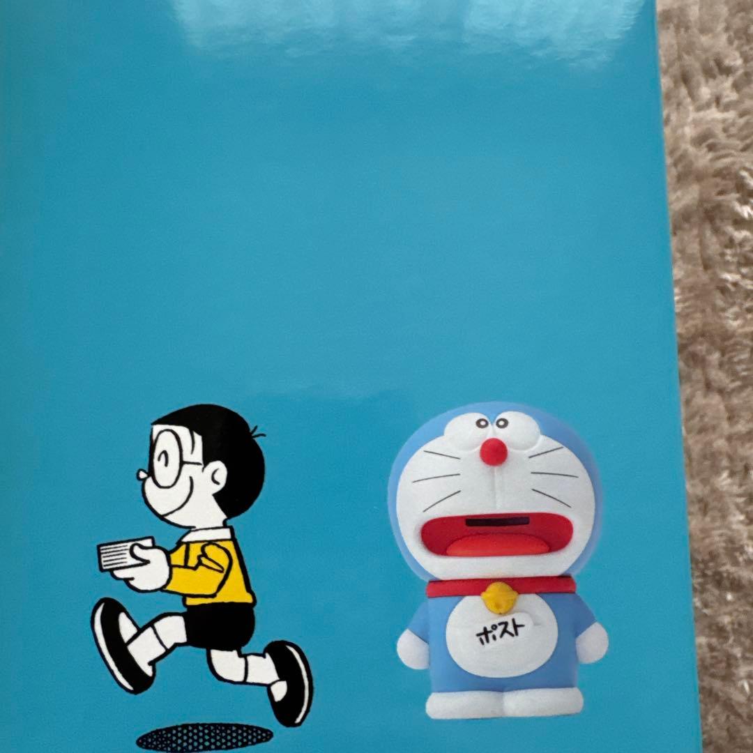 代用シールでポストになった ドラえもん 郵便局50周年 限定 貯金箱