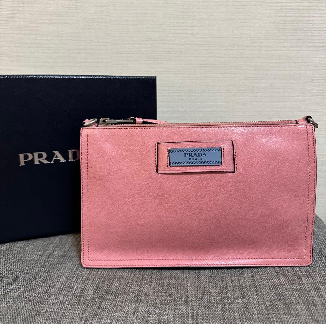 PRADA ピンク レザー ポーチ ストラップ付き - メルカリ