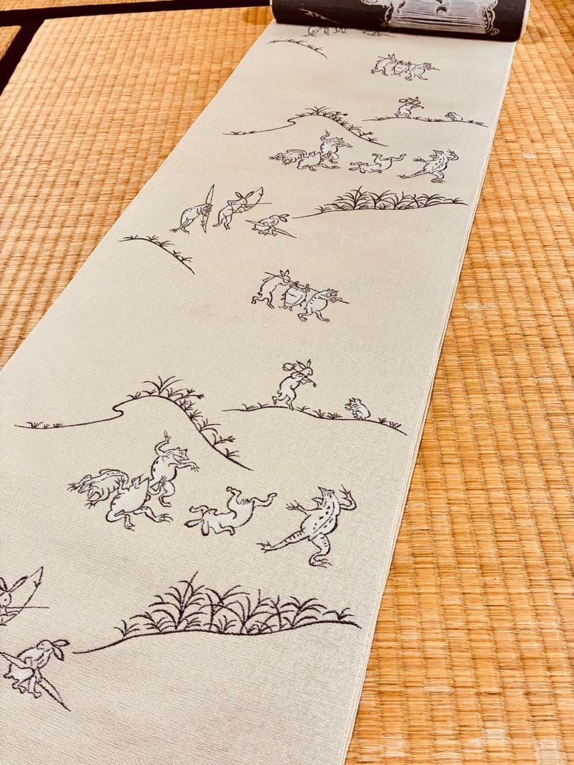 素敵な装い！西陣名古屋帯 綿芯仕立付 「鳥獣人物戯画」クリーム