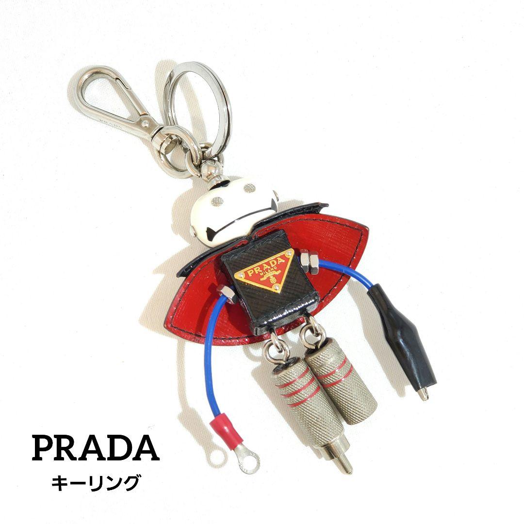 プラダ キーリング サフィアーノ ドラキュラ ロボット トリック 三角