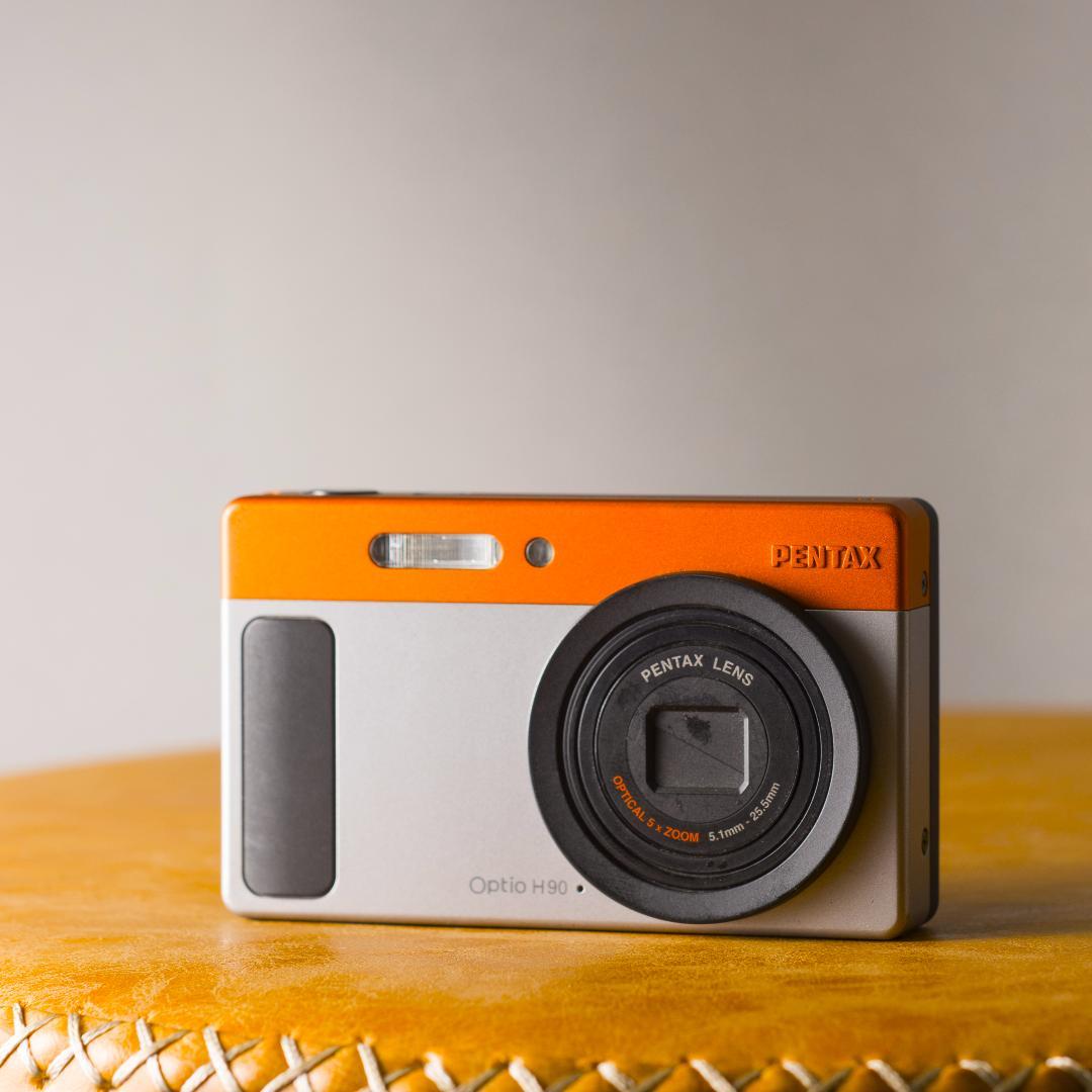 可愛いすぎるコンデジ】PENTAX optio H90 オレンジ×シルバー - メルカリ