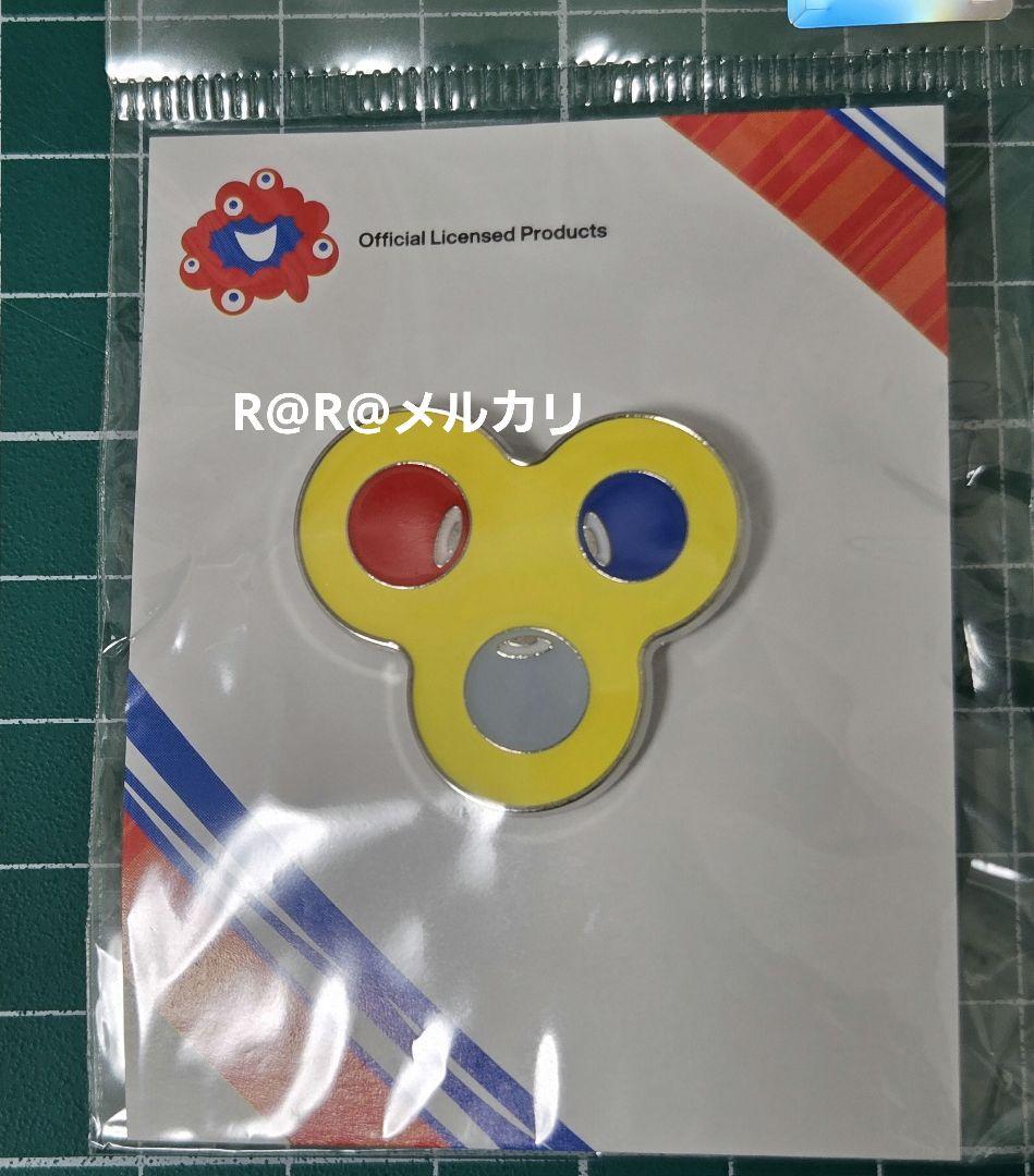 万博 コミャク ピンバッジ 黄色 EXPO2025 - メルカリ