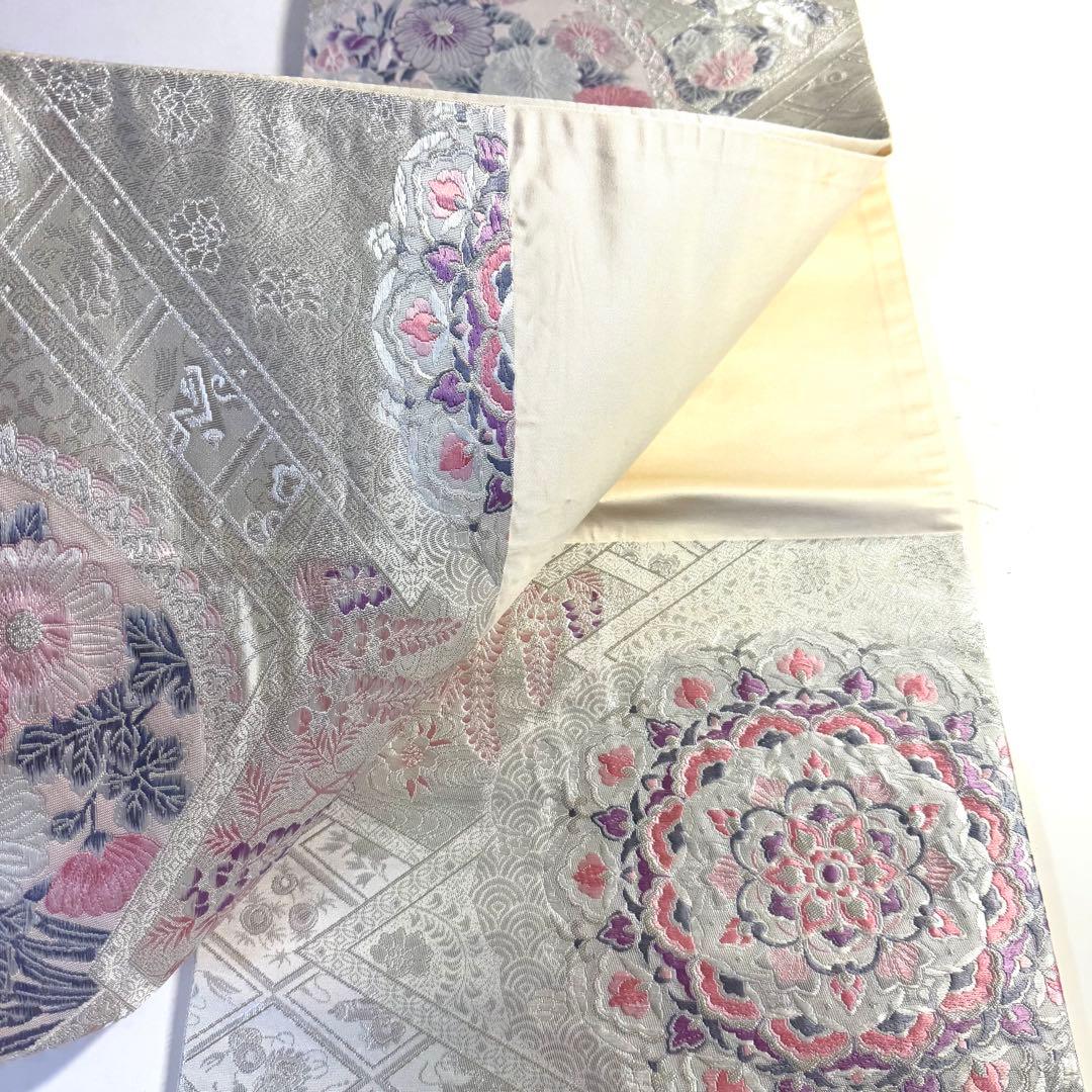 5k2780 袋帯 絹 唐織 プラチナ箔 正倉院文様 華文 銀色 白 ピンク 紫