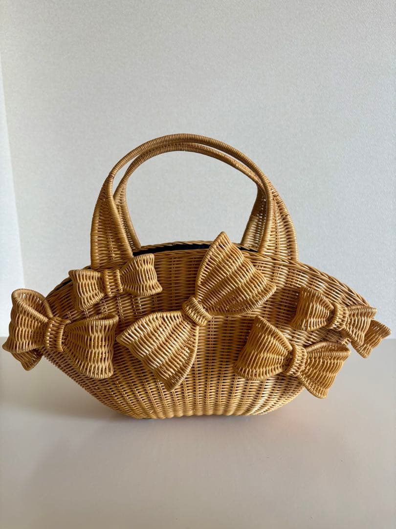アナトリエ　Anatelierリボン かごバッグ アナトリエ/かごバッグ/ポシェット/リボンモチーフ/ベージュの高価買取