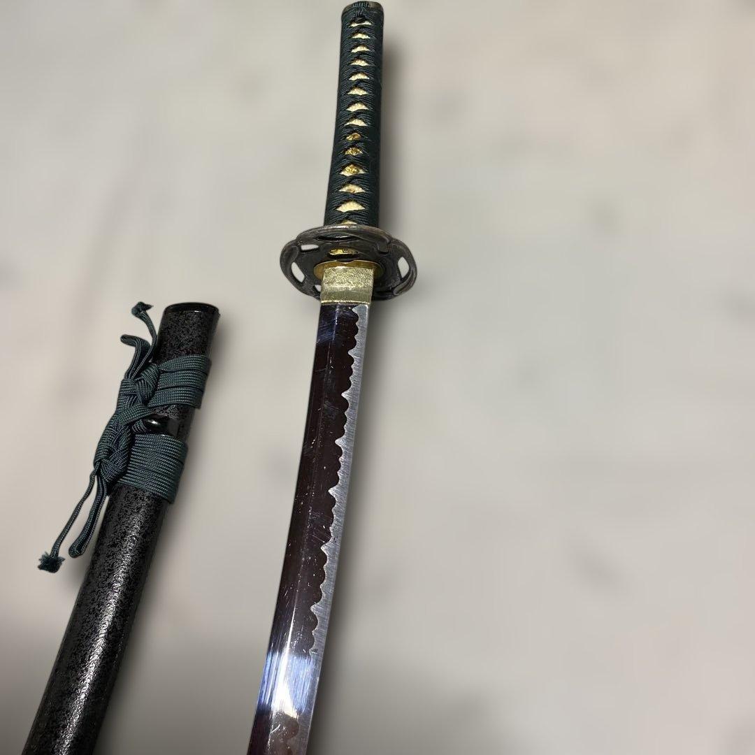 格安模造刀大刀 濃緑柄 波絵透し丸鍔 黒梨地鞘 - メルカリ