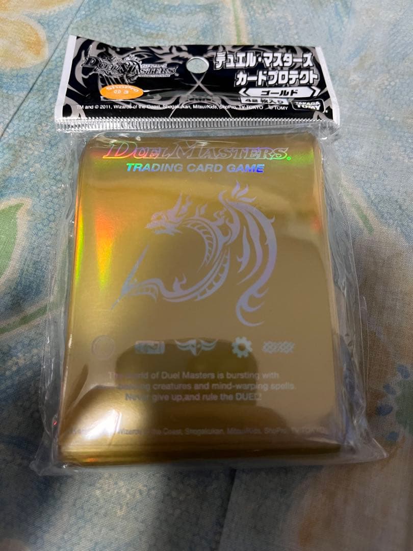 デュエルマスターズ　スリーブ　ゴールド　新品未開封 デュエルマスターズ - デュエマ 未開封新品 旧公式スリーブ10枚 の通販