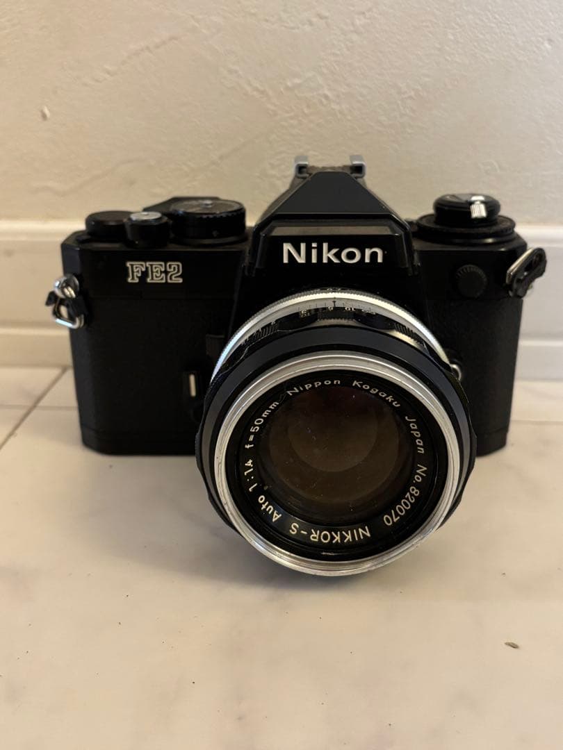Nikon ニコン FE2 ブラック NIKKOR-S 1:1.4 f=50mm Nikon FE-2 FE2 Black 35mm Camera with 50mm f1.8 AI-s Lens -New Seals-