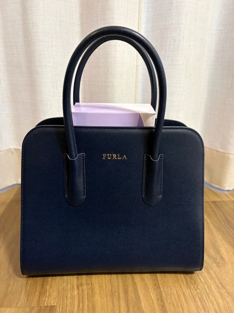 FURLA】ネイビー ハンドバッグ - メルカリ