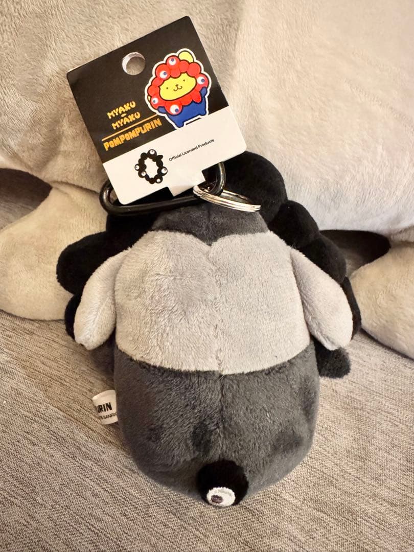 ミャクミャクEXPO2025 なりきりぬいぐるみ黒カラビナ付ポムポムプリン