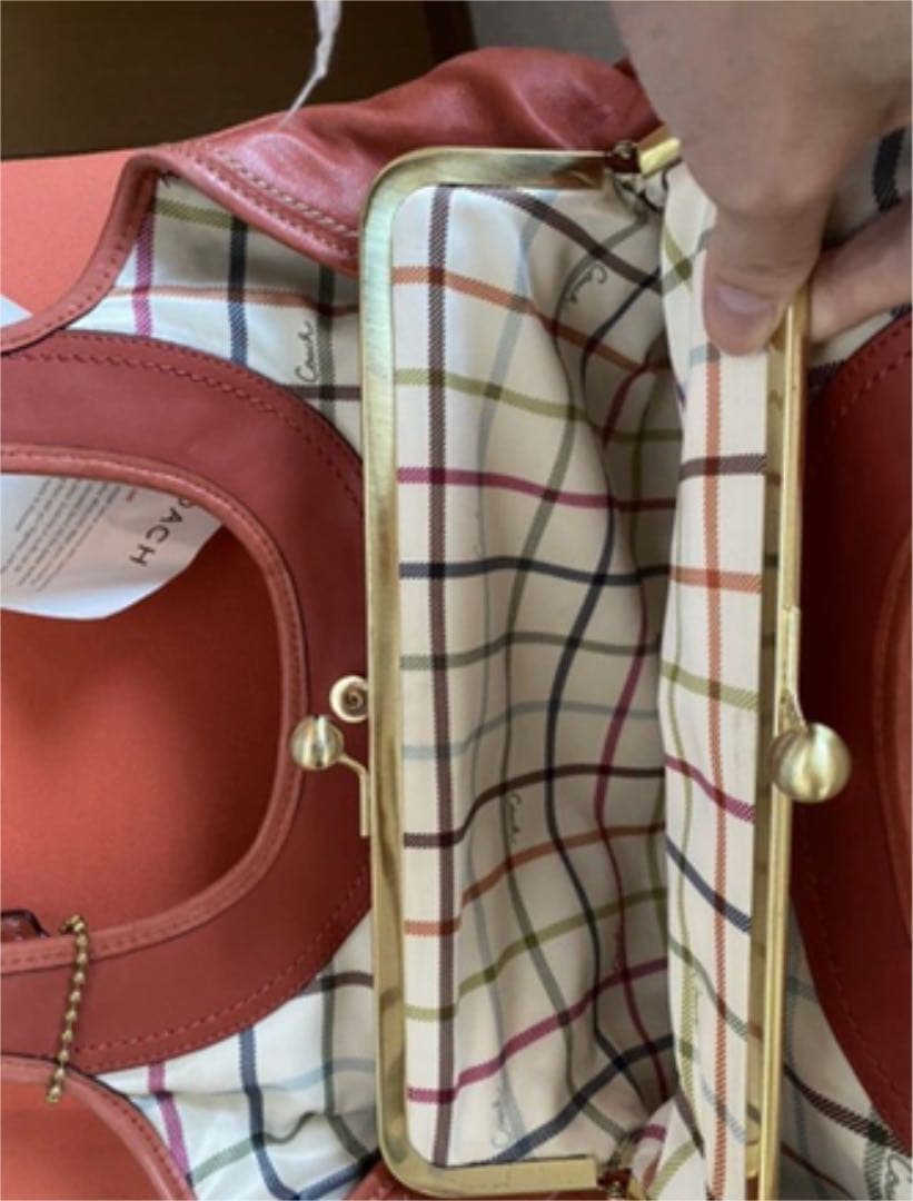 コーチ オレンジ エルゴレザープリーテッドフレームドサッチェルの通販